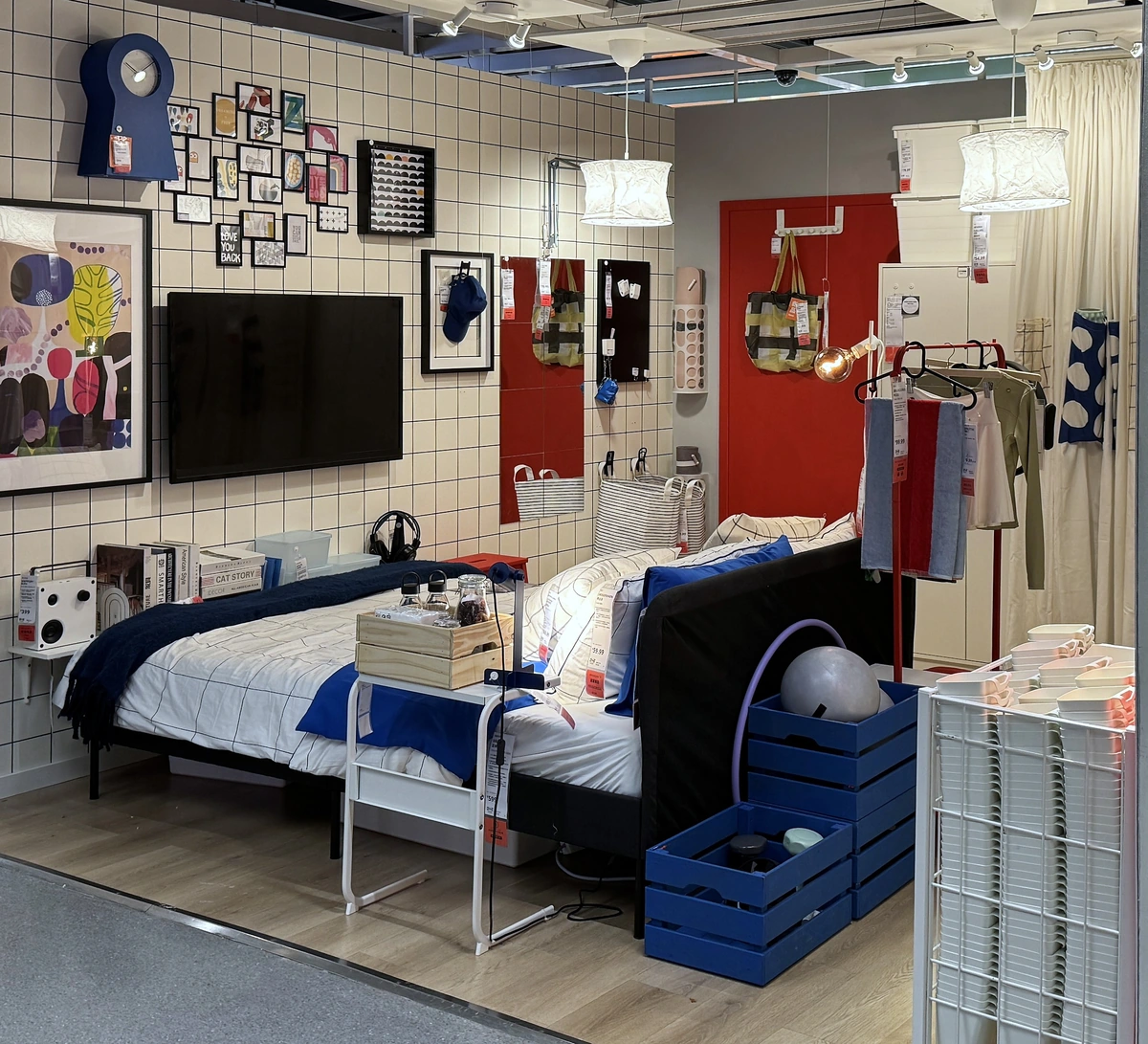 From the left of the opening: the bed, the side table and the crates behind it