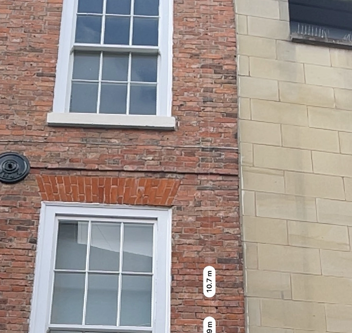 Retained brick and stone