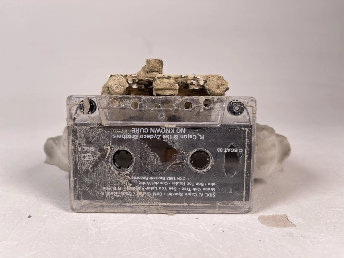 Cast fragment resting on a cassette