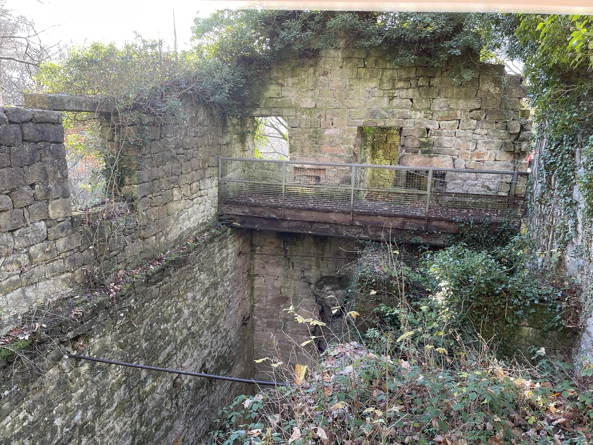 Inside the ruined walls, looking across a pit